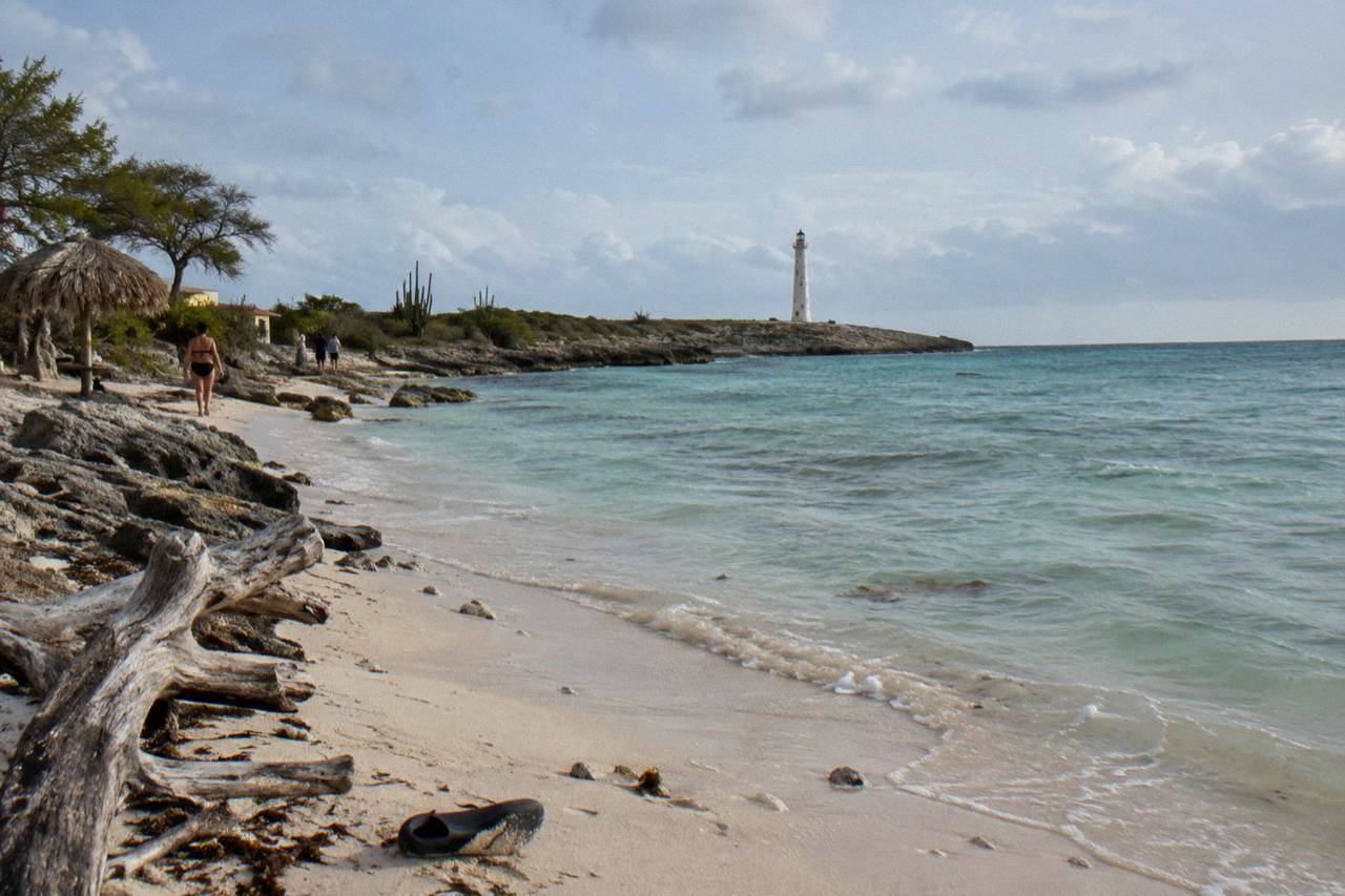 Calm turquoise water along a Caribbean shoreline with reef close to the sand