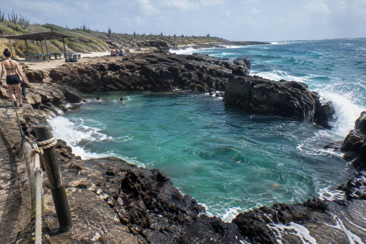 Calm turquoise water over a shallow coral reef close to shore