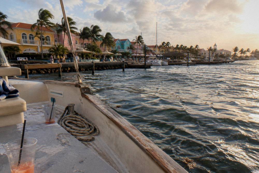 Open air deck of a boat at golden hour near the coast